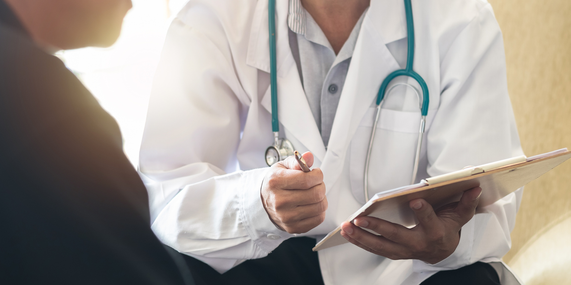 Doctor in discussion with male patient