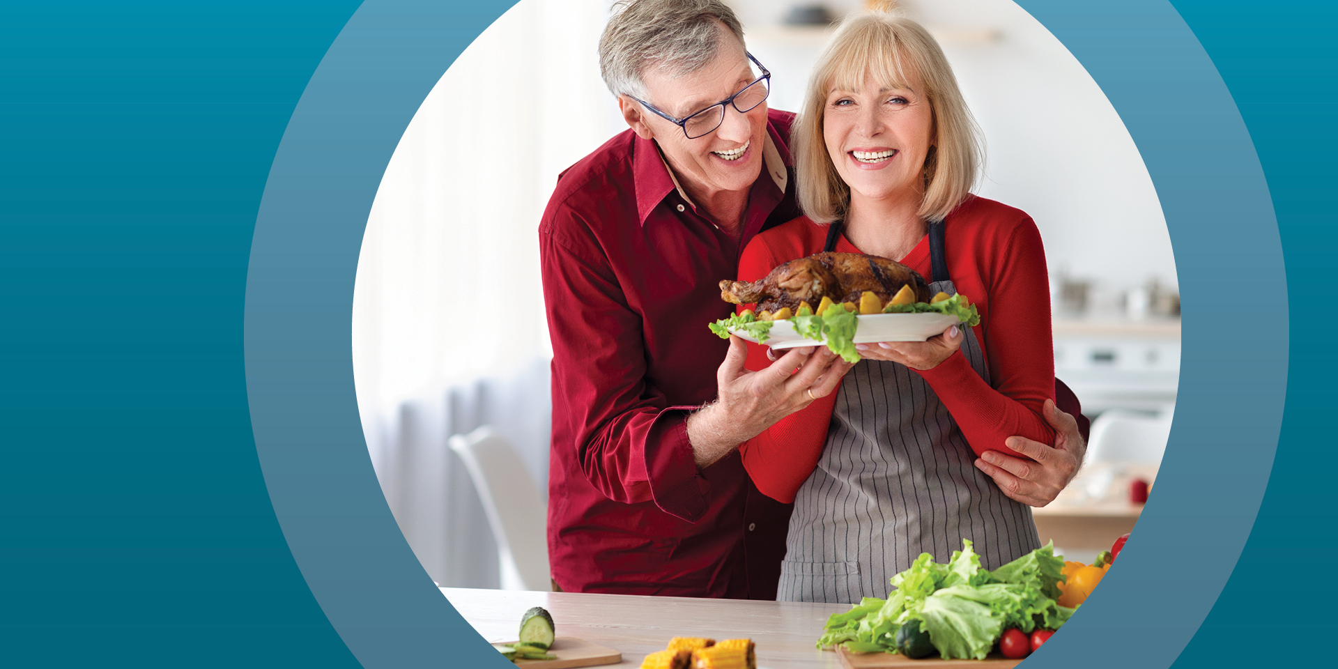 Man and woman in kitchen holding up holiday turkey | Doylestown Health