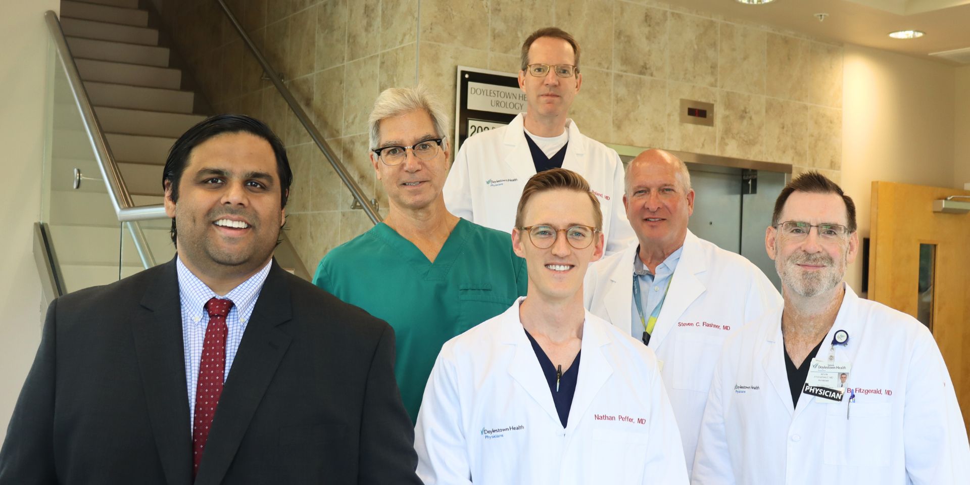 Urologists standing on stairs | Doylestown Health