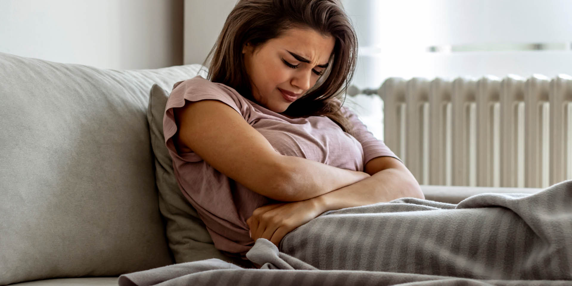 Woman having stomach pain | Doylestown Health