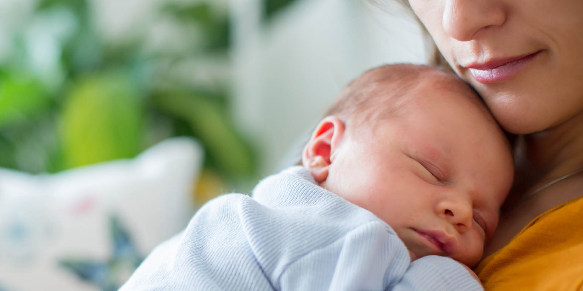 Close up of baby in mother’s arms | Doylestown Health