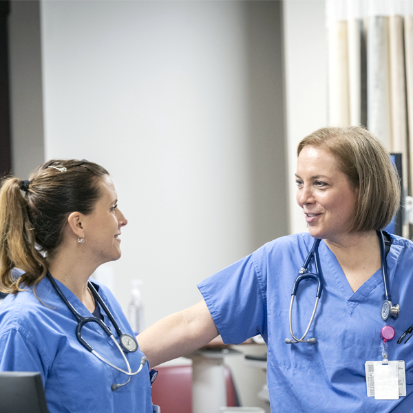 Nurses talking at the desk | Doylestown Health