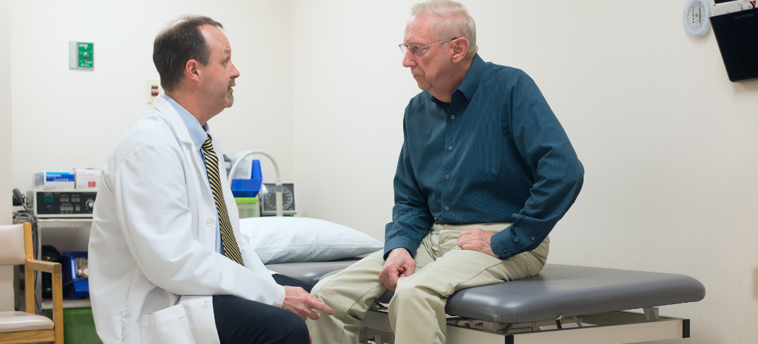 Doctor consulting with a Male patient| Doylestown Health
